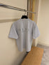 T-SHIRT WITH EMBROIDERED SIGNATURE