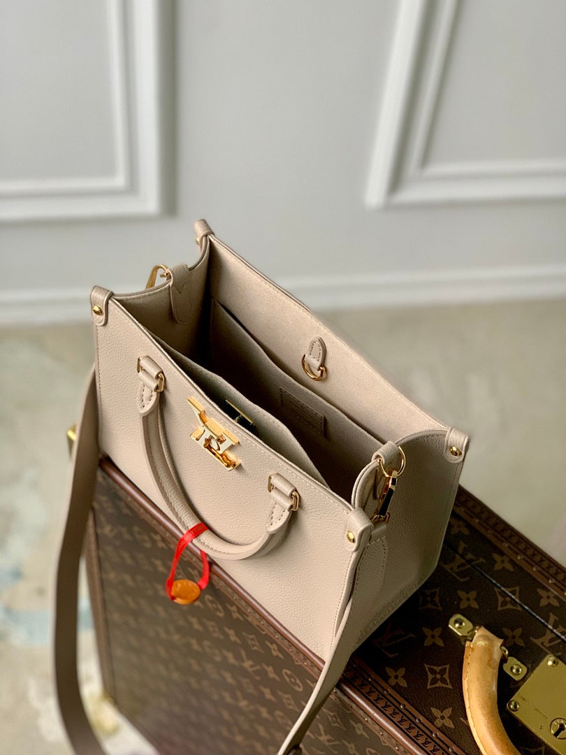 Sac à main OnTheGo – Réf. M22311 · Abricot Gris
