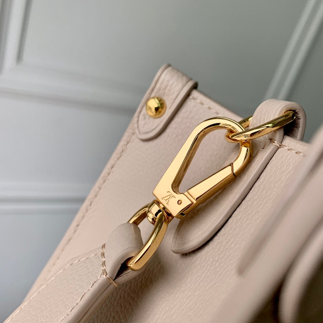 Sac à main OnTheGo – Réf. M22311 · Abricot Gris